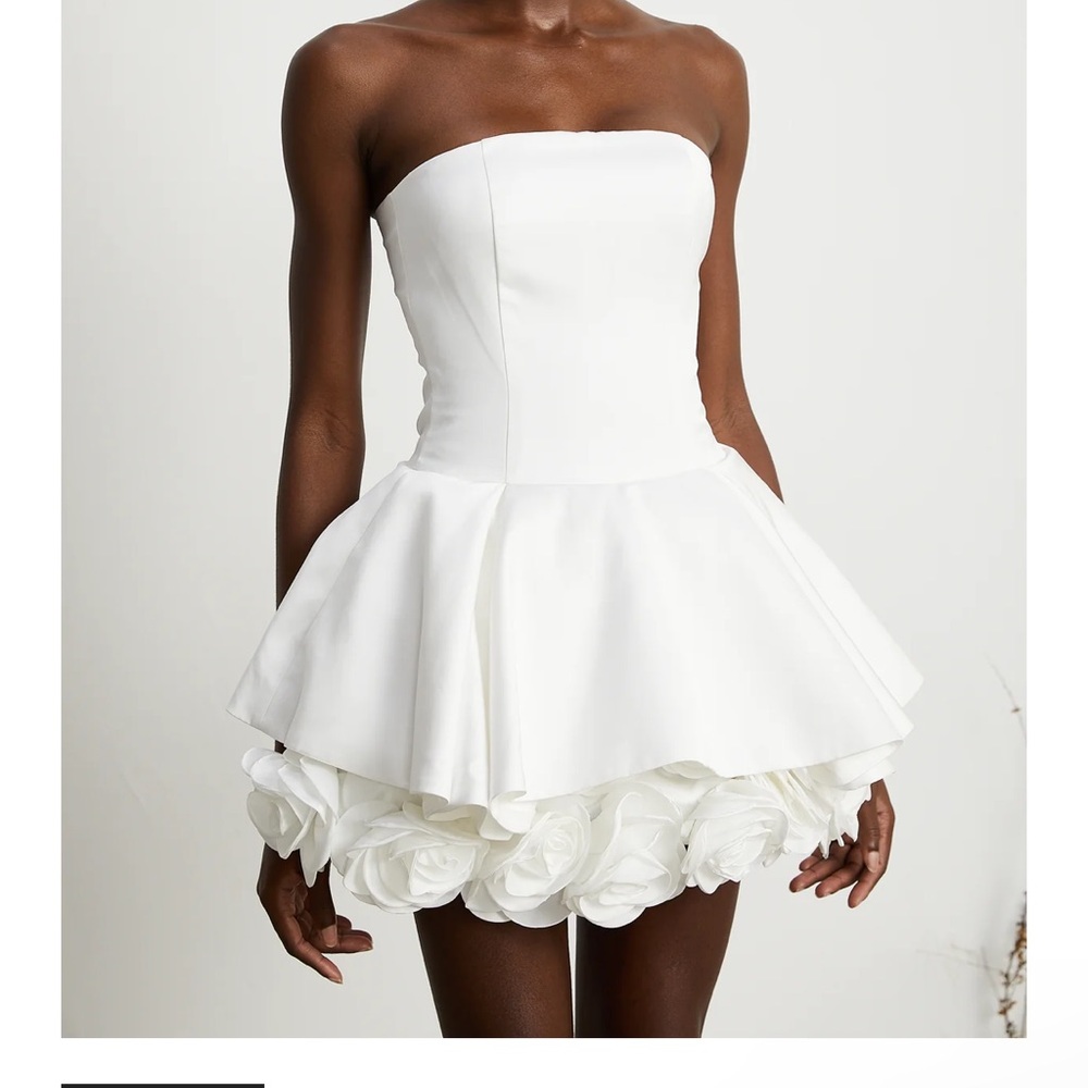 NEVER WORN- a white dress with flowers. A very trendy style!!